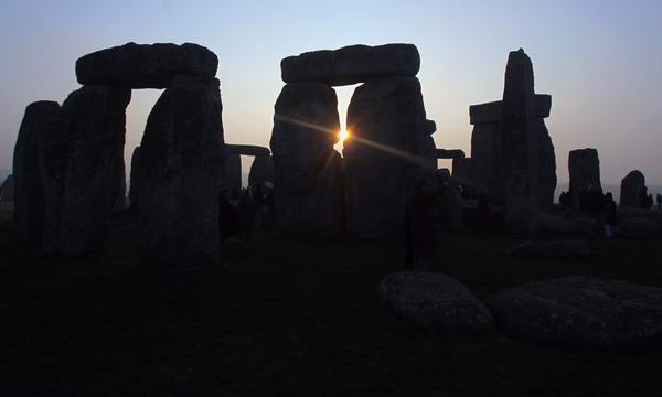 sun rises over Stonehenge
